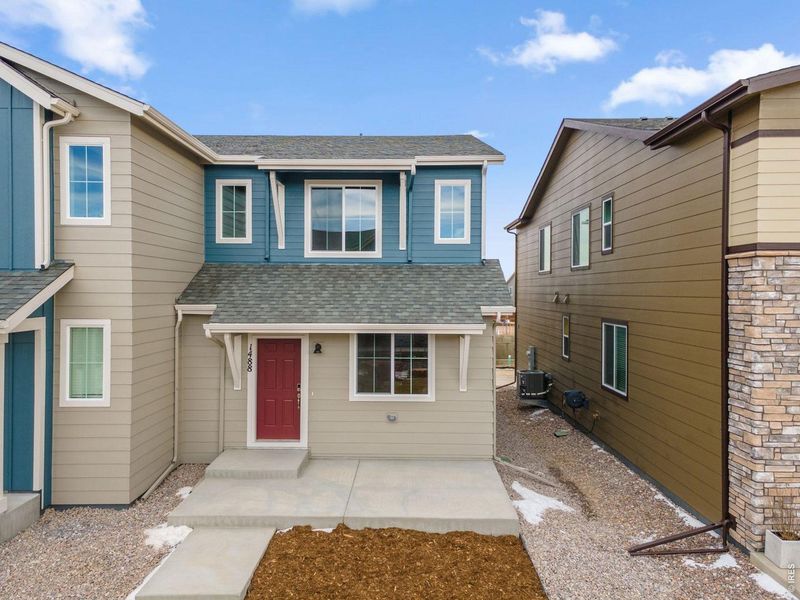 Exterior details and patio area of a home in Spring Valley, Longmont (Image 3).
