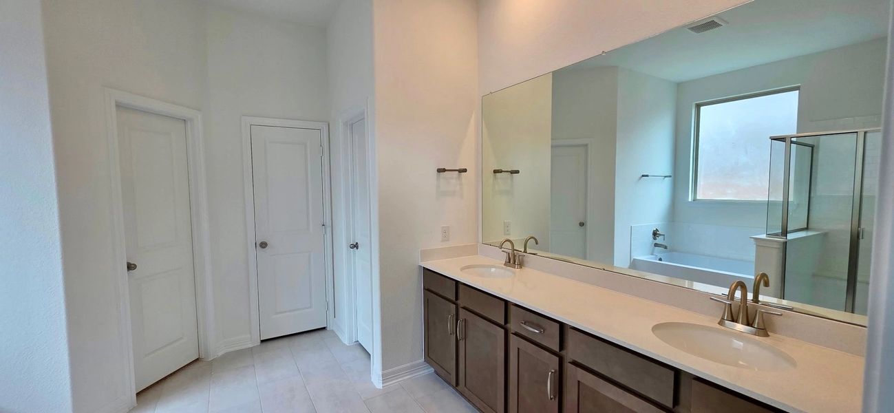 Furnished interior view inside a new home in Sunterra Lakes, Brookshire (Image 7).