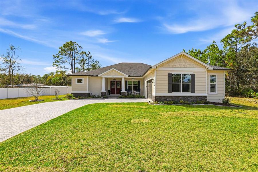 Front exterior of a new home in , Wesley Chapel, FL, highlighting curb appeal (Image 23).