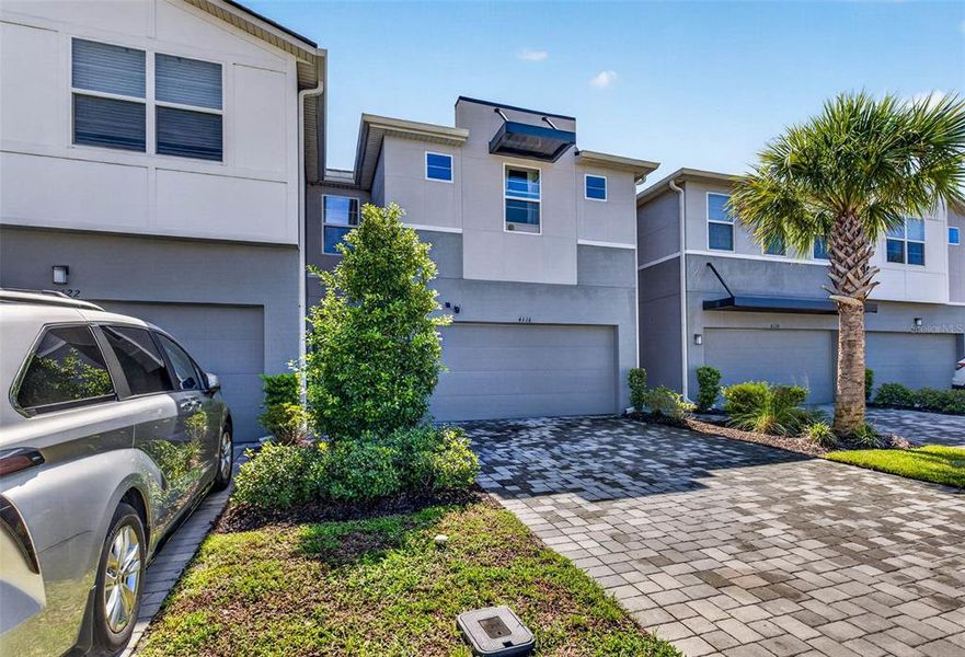 Front exterior of a new home in , Lutz, FL, highlighting curb appeal (Image 28).
