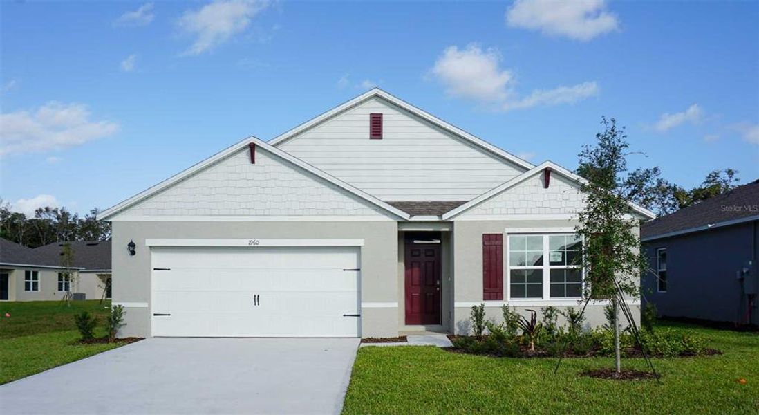 Front exterior of a new home in Crossroads at Kelly Park, Apopka, FL, highlighting curb appeal (Image 1).