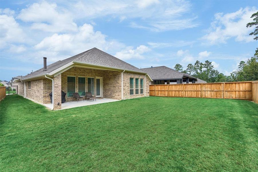 Eye-catching brick exterior on all 4 sides, gutters, sprinkler system, uplighting, and covered patio set this home apart from the rest!