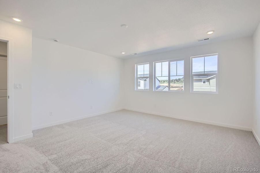 Spacious, unfurnished interior of a new home in Riano Ridge: The Monarch Collection, Loveland (Image 9).