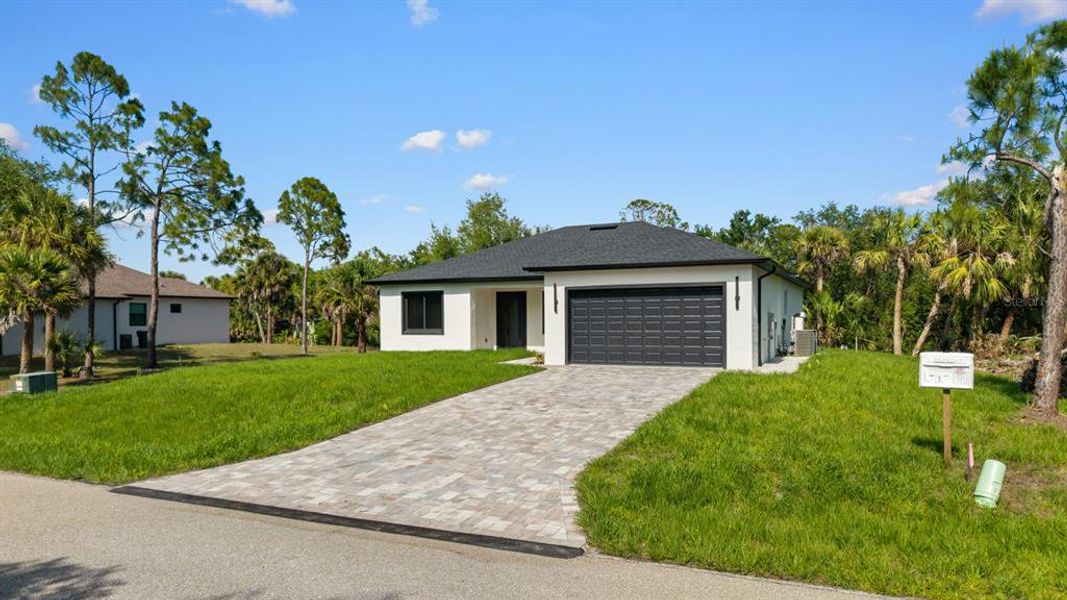 Front exterior of a new home in , Port Charlotte, FL, highlighting curb appeal (Image 24).