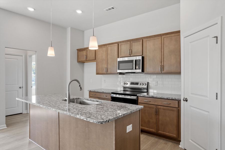 Furnished interior view inside a new home in Cambridge Reserve, Angier (Image 8).
