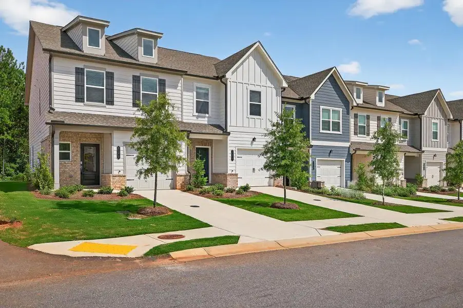 Front exterior of a new home in Fernhurst, McDonough, GA, highlighting curb appeal (Image 19).