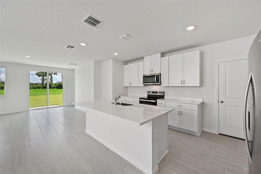 Furnished interior view inside a new home in Salt Meadows - Premier Series, Parrish (Image 7).