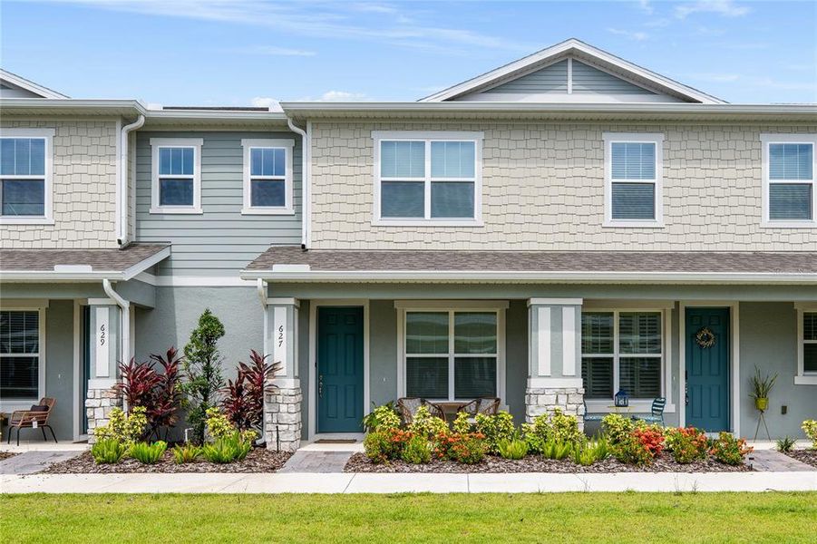 Front exterior of a new home in Rivington, Debary, FL, highlighting curb appeal (Image 20).