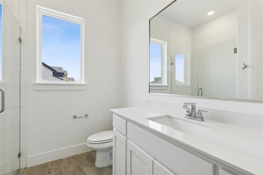 Friends and family will feel right at home in any of the beautifully finished guest baths.