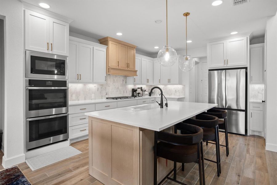Bright kitchen with abundant cabinetry and counter space
