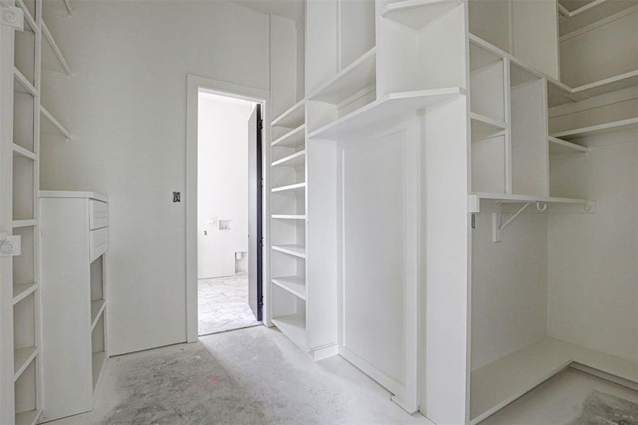 Unfurnished bedroom with a raised ceiling and multiple windows