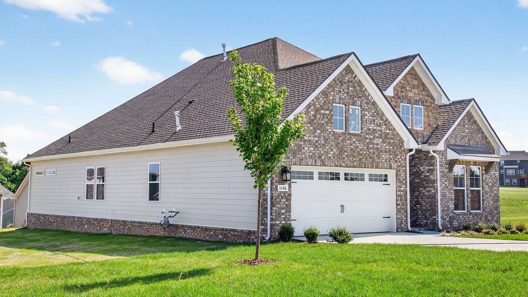 Front exterior of a new home in McClure Farms, Columbia, TN, highlighting curb appeal (Image 2).