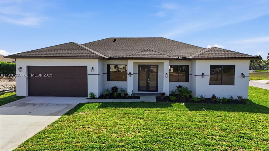 Front exterior of a new home in , Cape Coral, FL, highlighting curb appeal (Image 28).