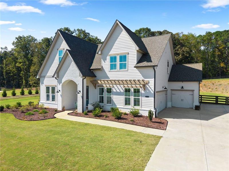 Front exterior of a new home in , Cumming, GA, highlighting curb appeal (Image 21).