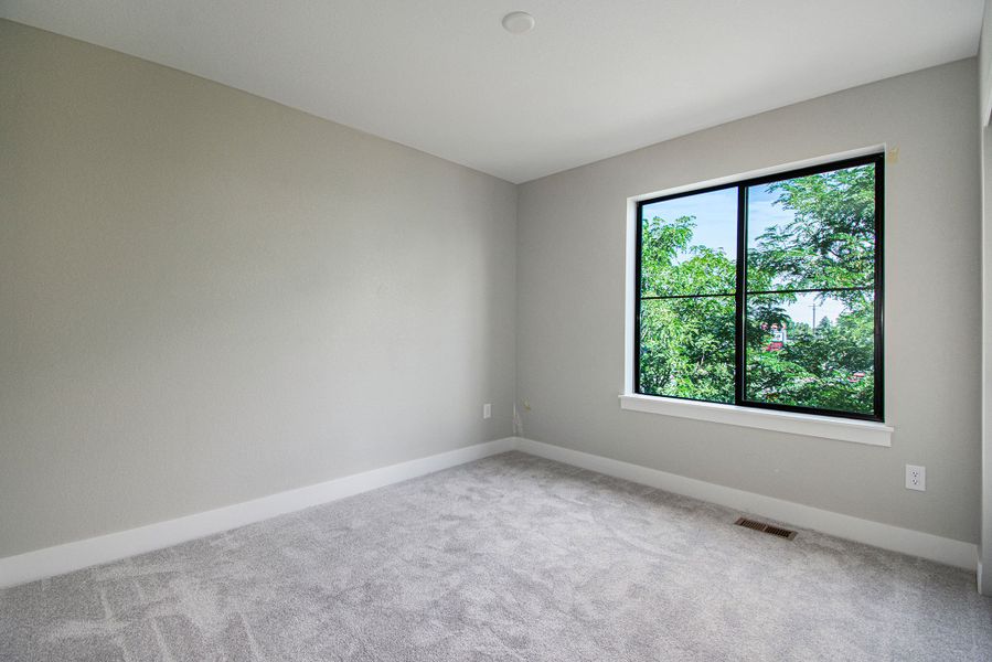 Representative unfurnished interior of a home built from the Taylor by Lokal Homes in The Commons at Victory Ridge, Colorado Springs (Image 21).