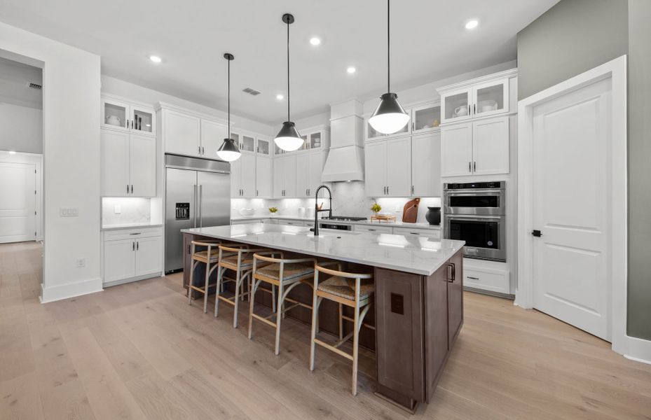 Representative furnished interior of a home built from the Layton Grande by DiVosta in BeachWalk by Manasota Key, Englewood (Image 17).