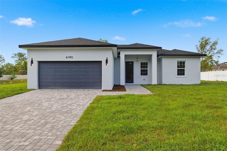 Front exterior of a new home in , Ocala, FL, highlighting curb appeal (Image 20).