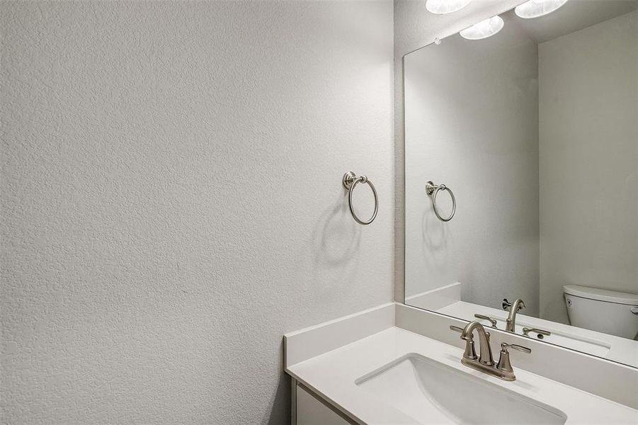 Bathroom featuring toilet and vanity