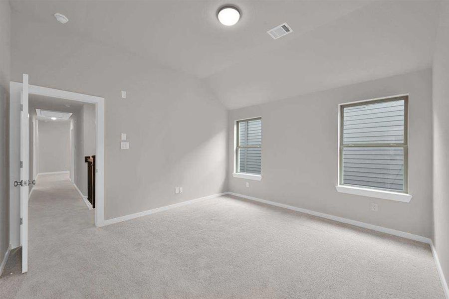 Secondary Bedroom - Spacious, light-filled room with a neutral palette. (Original Builder Staged Photo 2024)
