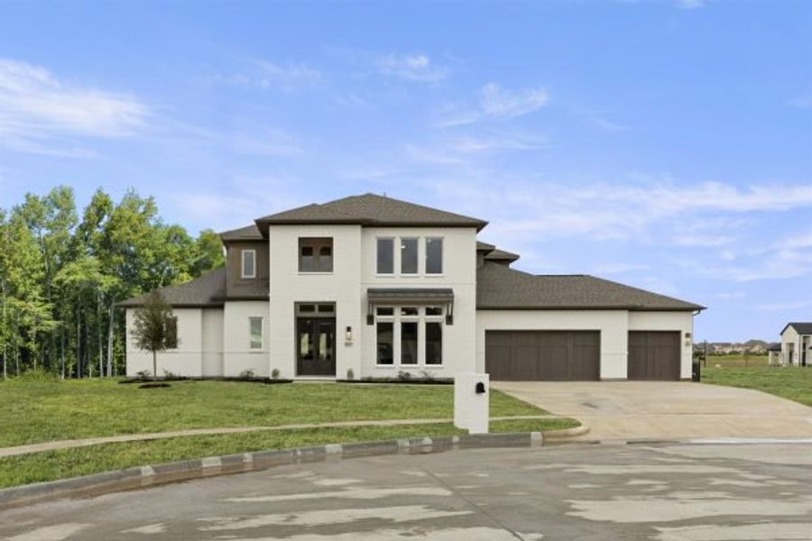 Representative exterior photo of a completed home built from the Tahiti by Stonefield Homes in Heath Golf and Yacht Club, Rockwall, TX (Image 32).