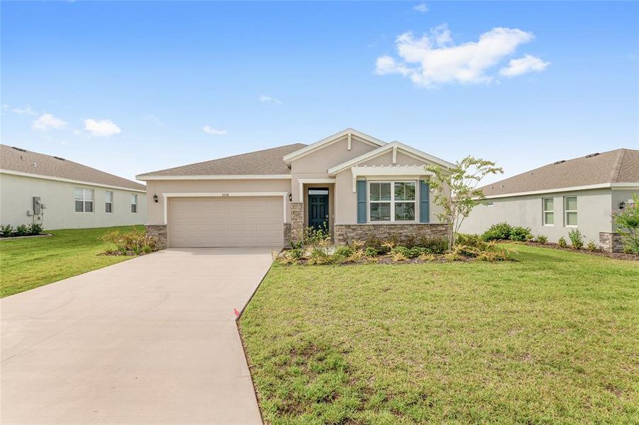 Front exterior of a new home in JB Ranch, Ocala, FL, highlighting curb appeal (Image 28). Front exterior of a new home in JB Ranch, Ocala, FL, highlighting curb appeal (Image 28).