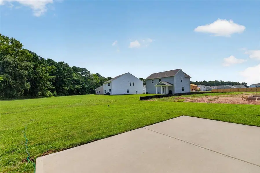 Front exterior of a new home in , St. George, SC, highlighting curb appeal (Image 1). Front exterior of a new home in , St. George, SC, highlighting curb appeal (Image 1).