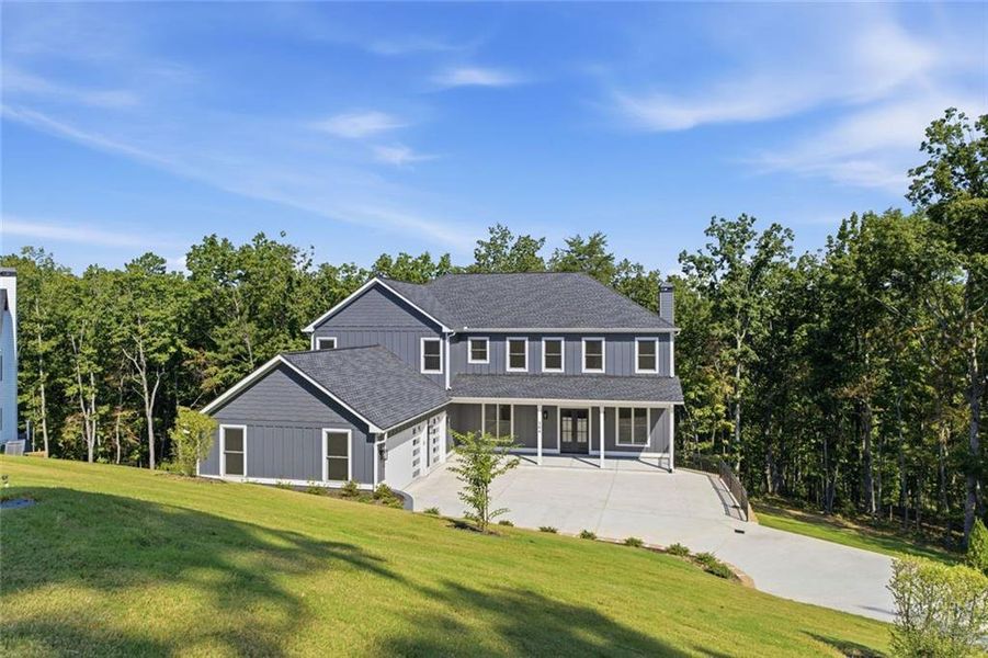 Front exterior of a new home in , Ball Ground, GA, highlighting curb appeal (Image 31).