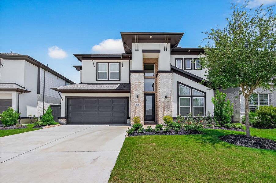 Front exterior of a new home in , Richmond, TX, highlighting curb appeal (Image 23). Front exterior of a new home in , Richmond, TX, highlighting curb appeal (Image 23).