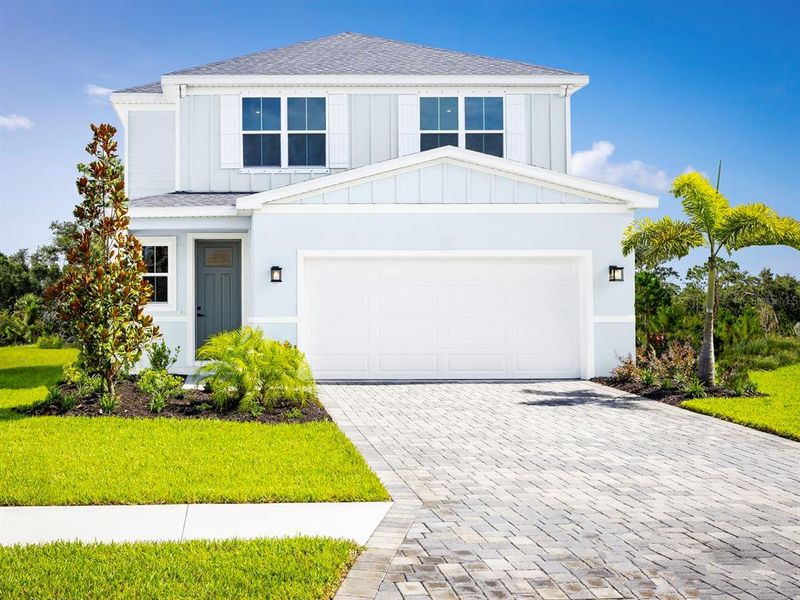 Front exterior of a new home in Malabar Springs, Palm Bay, FL, highlighting curb appeal (Image 2).