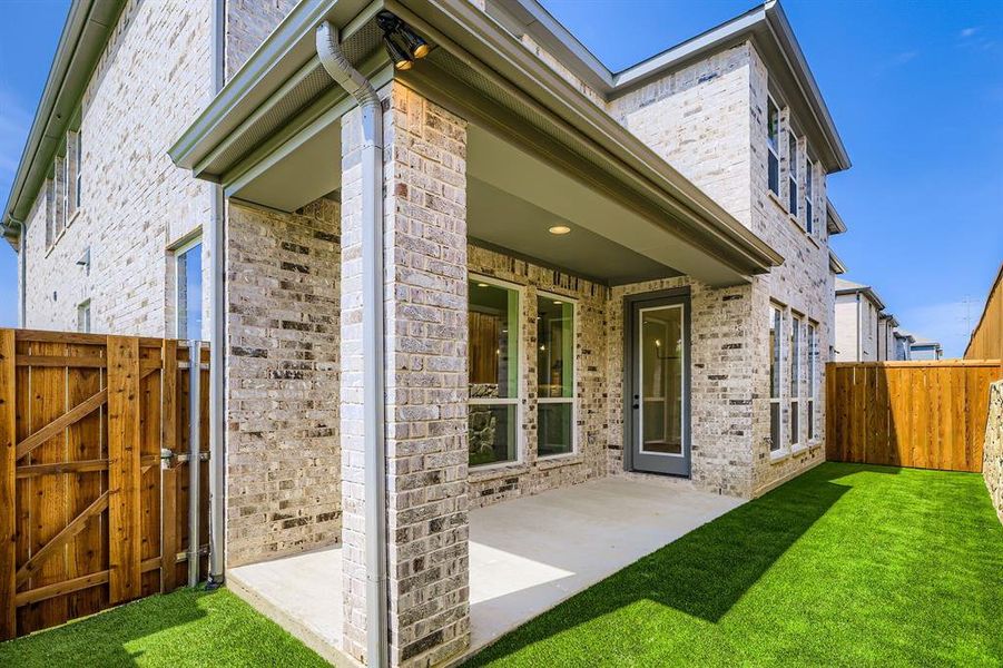 Front exterior of a new home in Castle Hills Northpointe - Townhomes, Lewisville, TX, highlighting curb appeal (Image 14).