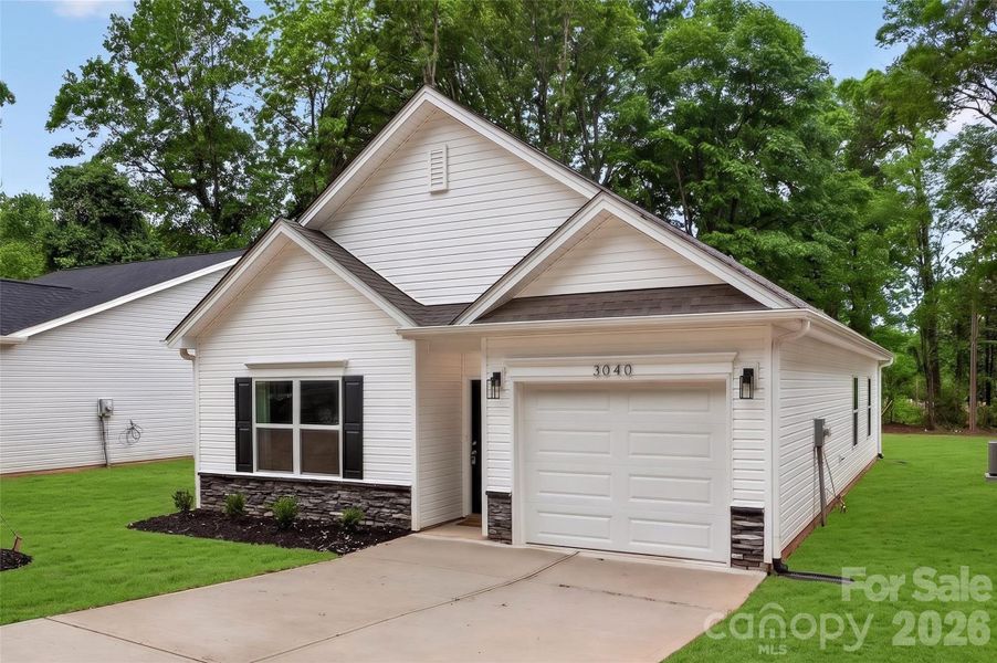 Front exterior of a new home in , Charlotte, NC, highlighting curb appeal (Image 1). Front exterior of a new home in , Charlotte, NC, highlighting curb appeal (Image 1).