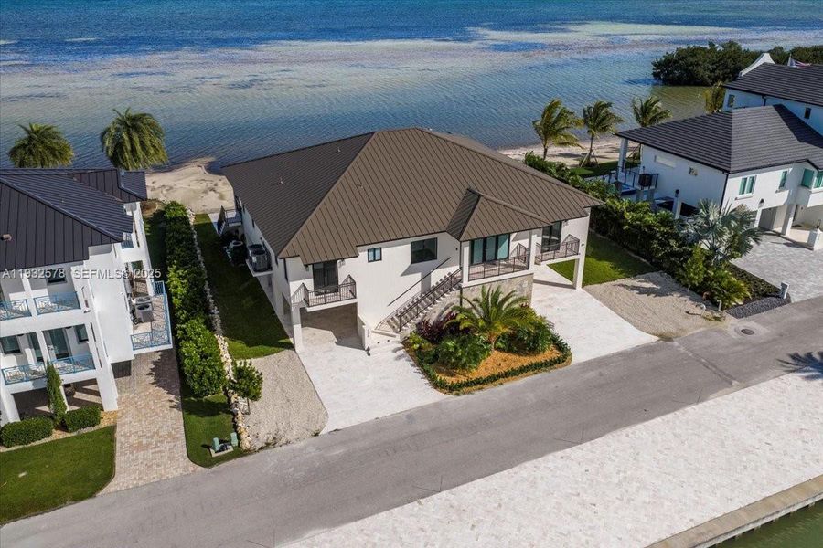 Front exterior of a new home in , Marathon, FL, highlighting curb appeal (Image 2).