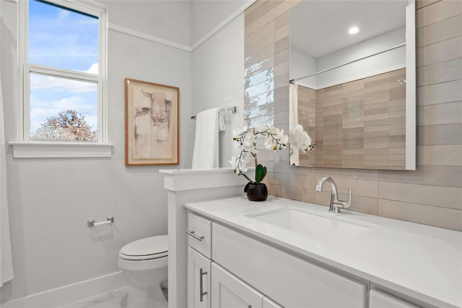 Full bathroom featuring vanity and a shower Full bathroom featuring vanity and a shower