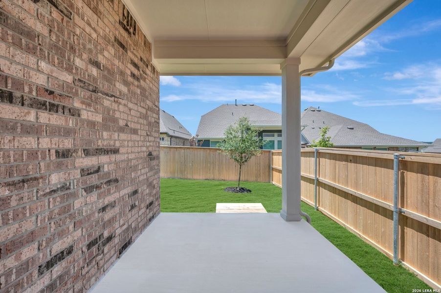 Exterior details and patio area of a home in Mayfair - Select Garden Series, New Braunfels (Image 2). Exterior details and patio area of a home in Mayfair - Select Garden Series, New Braunfels (Image 2).