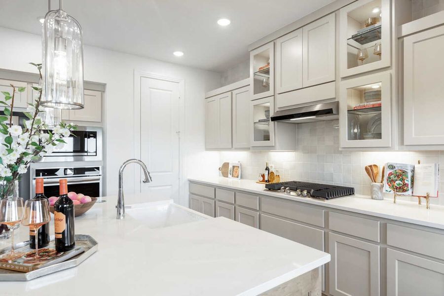 Representative furnished interior of a home built from the Monet-SS by Highland Homes in Lariat, Liberty Hill (Image 11).