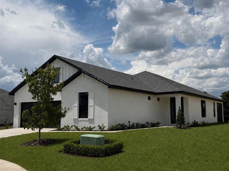 Front exterior of a new home in Sabana Reserve, Ocala, FL, highlighting curb appeal (Image 1). Front exterior of a new home in Sabana Reserve, Ocala, FL, highlighting curb appeal (Image 1).