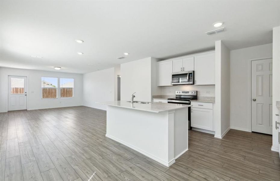 Airy kitchen with ample cabinet space *real home pictured