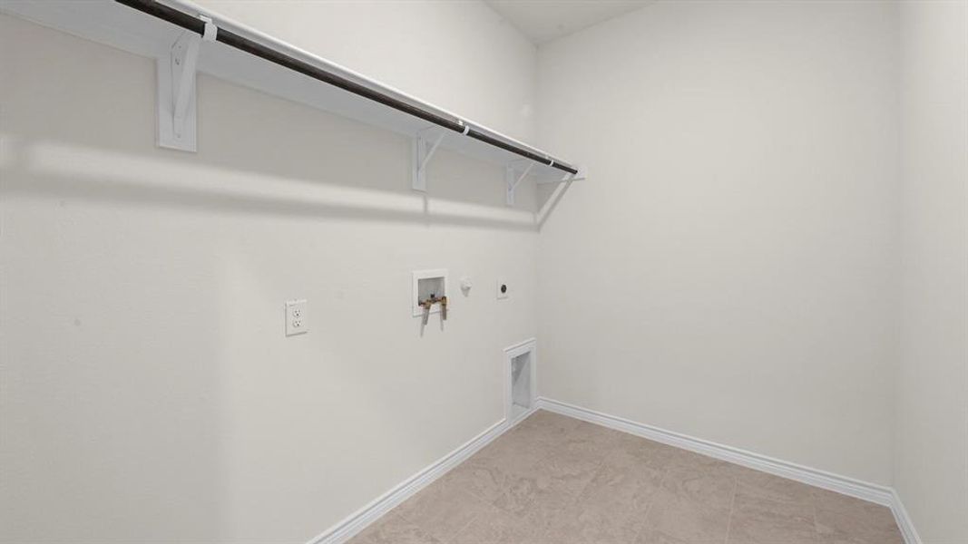 Washroom with gas dryer hookup, washer hookup, and electric dryer hookup