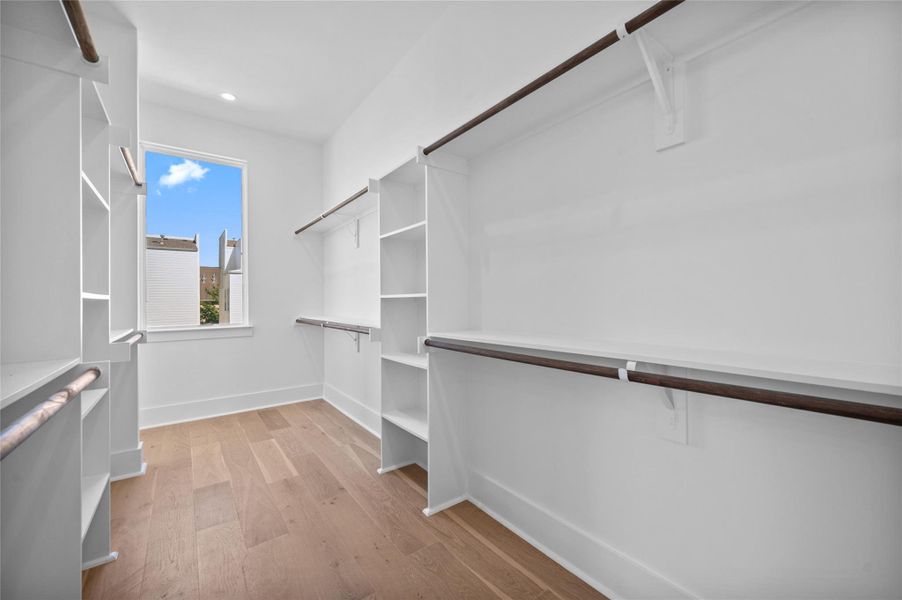 View of spacious Primary Suite closet. Note the natural light