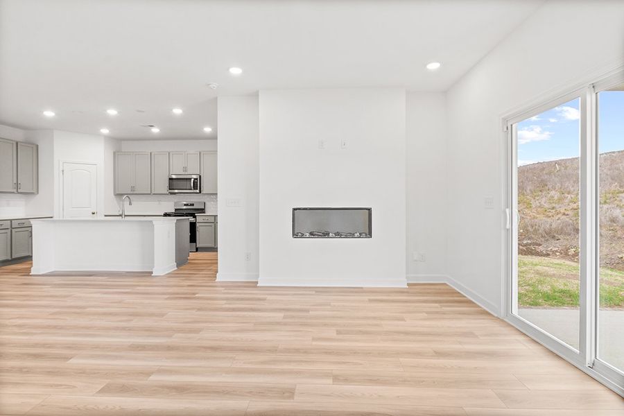 A kitchen with a wood floor. A kitchen with a wood floor.