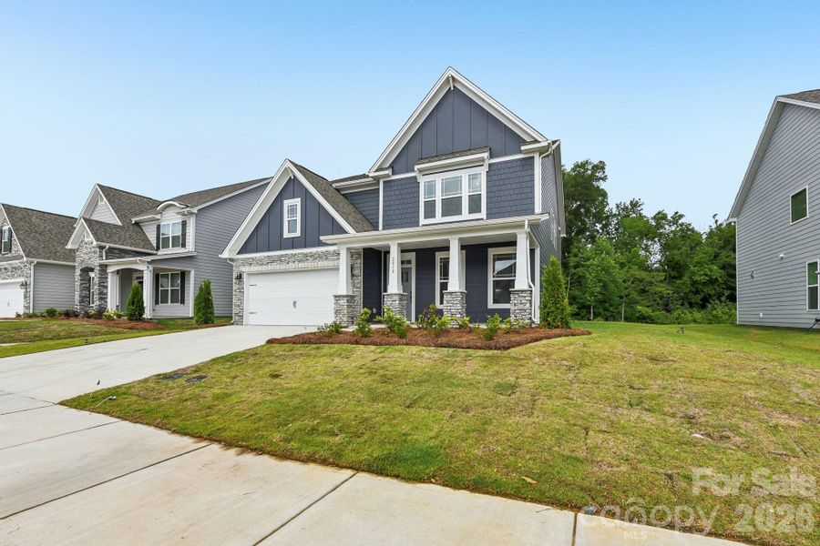 Front exterior of a new home in Sanctuary at Southgate, Indian Trail, NC, highlighting curb appeal (Image 1). Front exterior of a new home in Sanctuary at Southgate, Indian Trail, NC, highlighting curb appeal (Image 1).