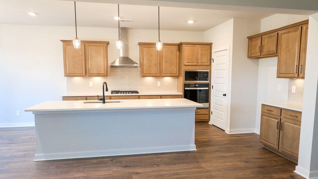 Representative furnished interior of a home built from the STONEBROOK II by D.R. Horton in Harvest Point, Spring Hill (Image 7).