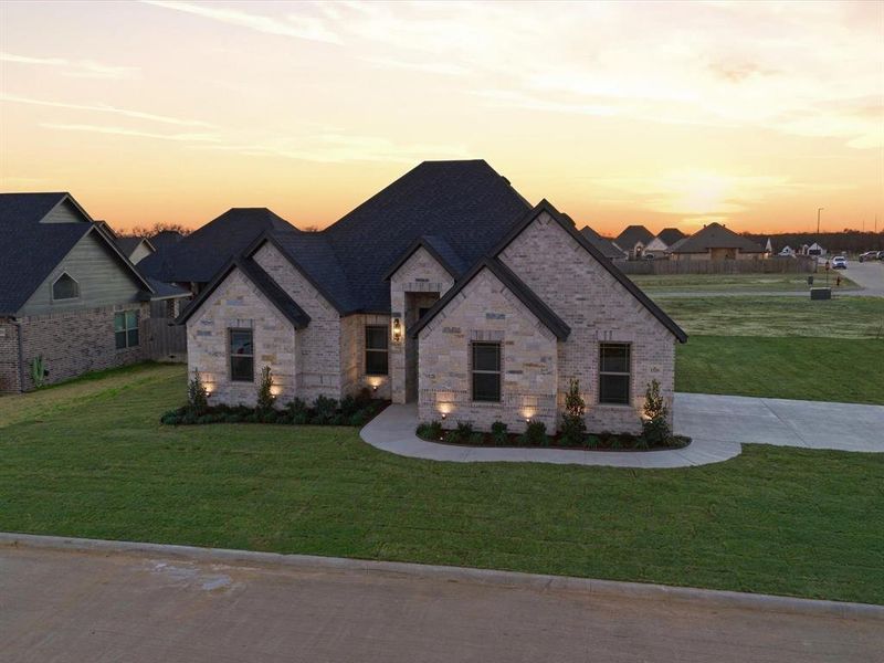 Front exterior of a new home in , Tolar, TX, highlighting curb appeal (Image 23).