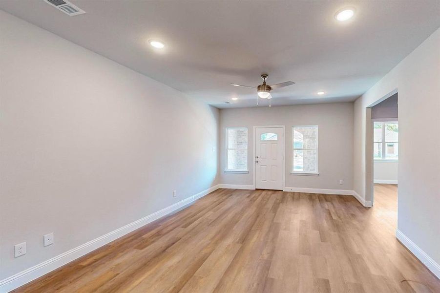 Foyer with light wood-type flooring and ceiling fan