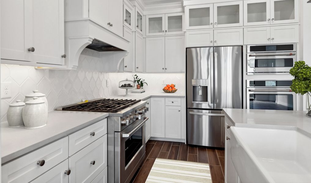 Kitchen with glass upper cabinets and hexagonal backsplash Kitchen with glass upper cabinets and hexagonal backsplash