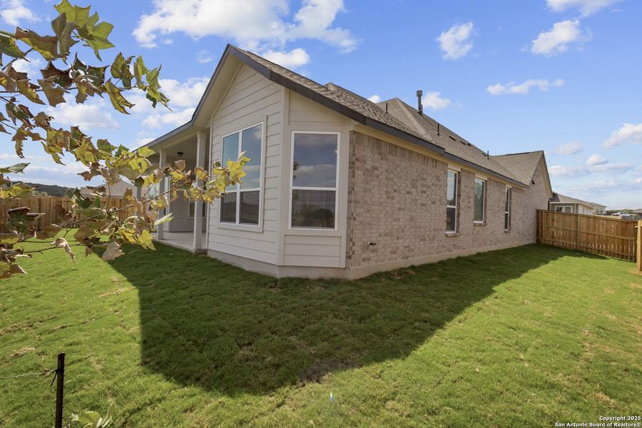 Exterior details and patio area of a home in Homestead 75', Schertz (Image 20).