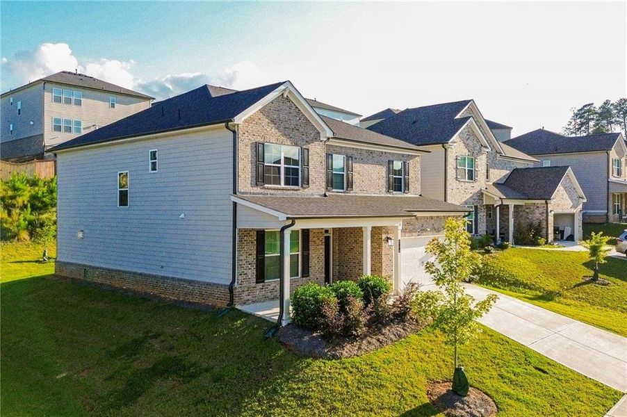 Front exterior of a new home in , South Fulton, GA, highlighting curb appeal (Image 21). Front exterior of a new home in , South Fulton, GA, highlighting curb appeal (Image 21).