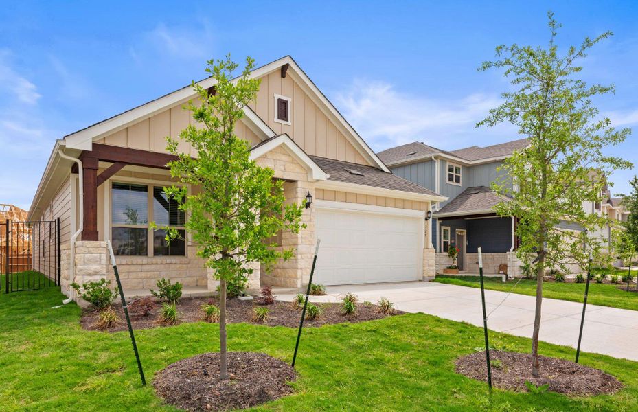 Front exterior of a new home in Santa Rita Ranch, Liberty Hill, TX, highlighting curb appeal (Image 17).