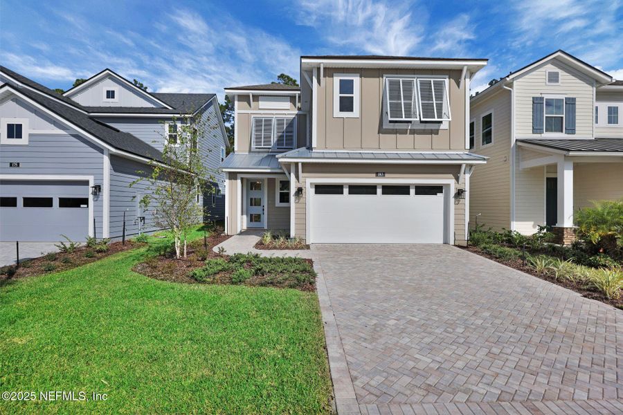 Front exterior of a new home in Crosswinds at Nocatee, Ponte Vedra, FL, highlighting curb appeal (Image 2).