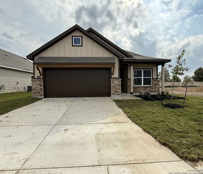 Front exterior of a new home in Enclave at Hennersby Hollow 50's, San Antonio, TX, highlighting curb appeal (Image 1).